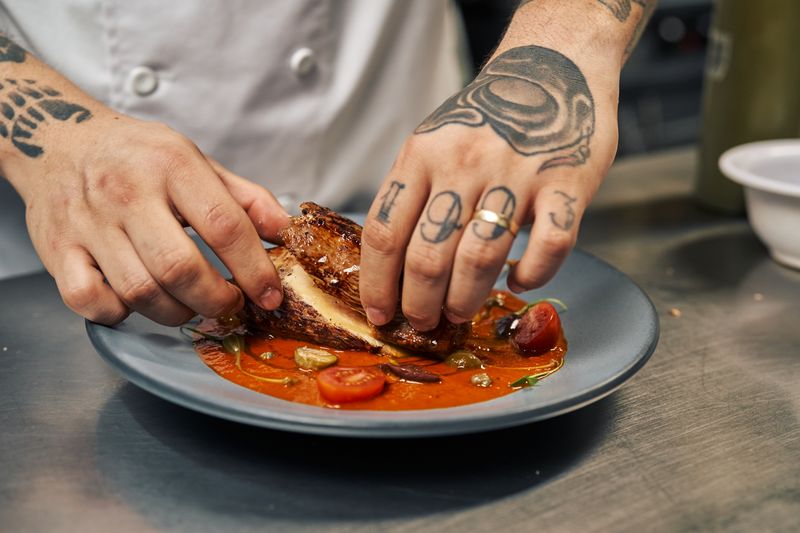 Bone-in hot chicken pieces served at catering event
